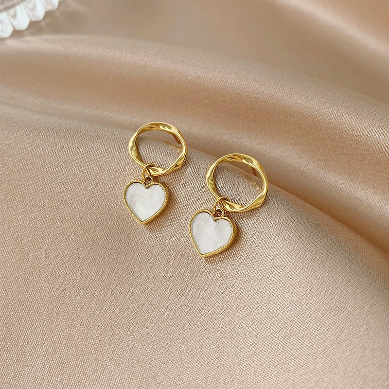Twisted geometric white shell earrings