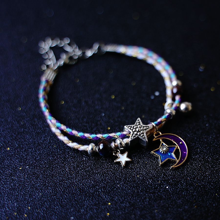 A Pair Of Women's Star And Moon Bracelets