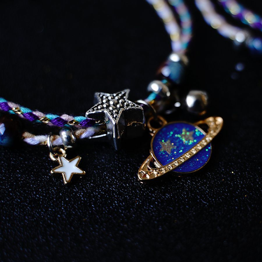 A Pair Of Women's Star And Moon Bracelets