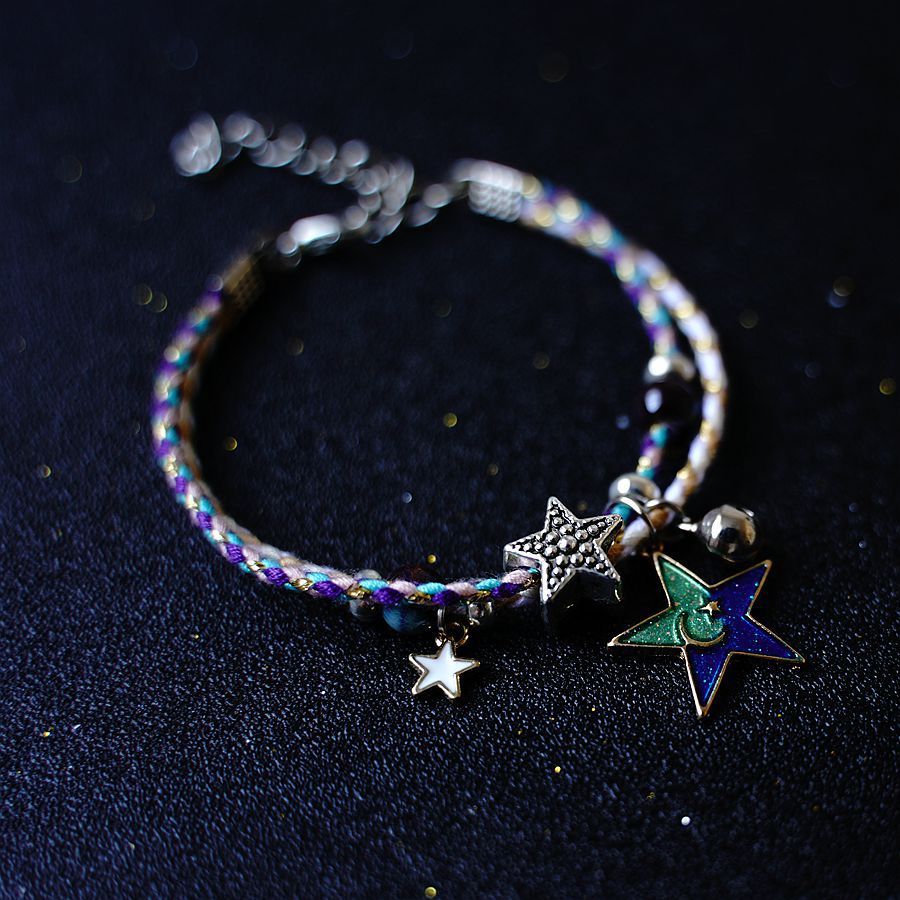 A Pair Of Women's Star And Moon Bracelets