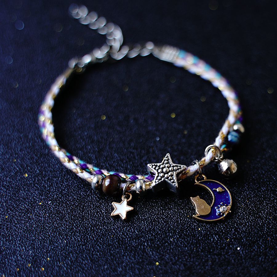 A Pair Of Women's Star And Moon Bracelets